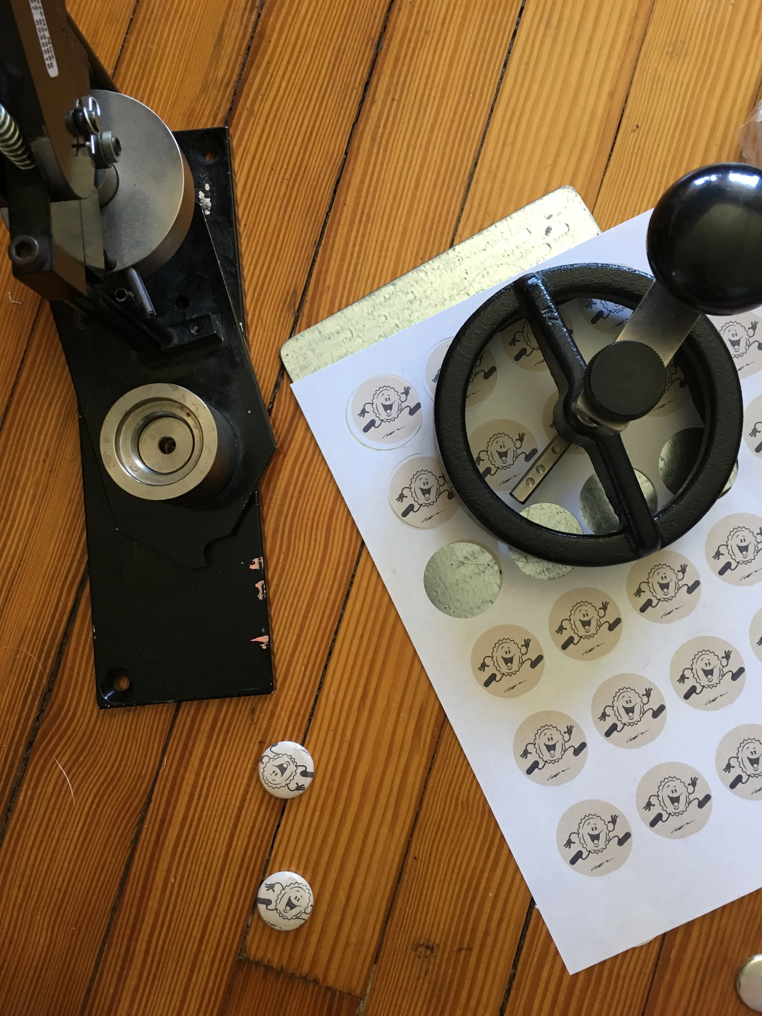 Make a ton of buttons out of the new PFB mascot.