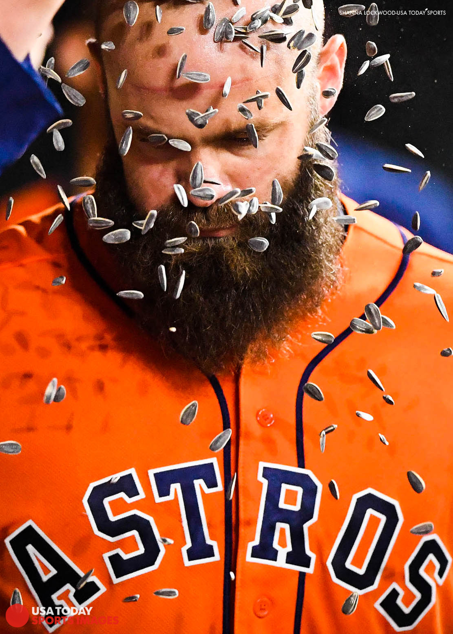  Jun 1, 2018; Houston, TX, USA; Houston Astros catcher Evan Gattis (11) has sunflower seeds poured over his head after hitting a two-run home run during the eighth inning against the Boston Red Sox at Minute Maid Park. Mandatory Credit: Shanna Lockwo