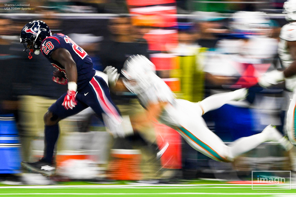  Oct 25, 2018; Houston, TX, USA; (Editor Note: Slow-shutter photo.) Houston Texans running back Alfred Blue (28) runs the ball as Miami Dolphins linebacker Kiko Alonso (47) defends during the fourth quarter at NRG Stadium. Mandatory Credit: Shanna Lo