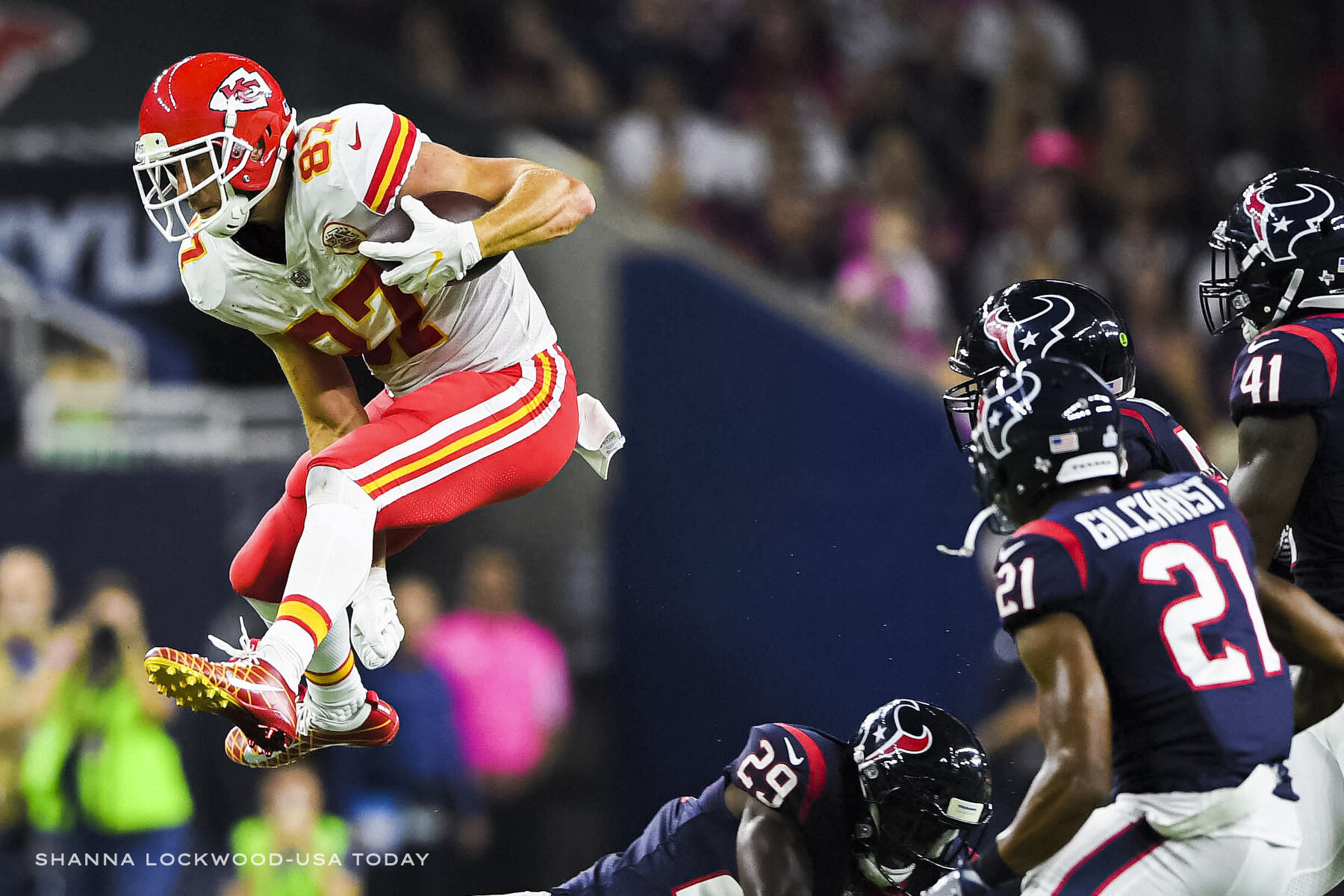  Oct 8, 2017; Houston, TX, USA; Kansas City Chiefs tight end Travis Kelce (87) jumps over Houston Texans free safety Andre Hal (29) during the first quarter at NRG Stadium. Mandatory Credit: Shanna Lockwood-USA TODAY Sports 