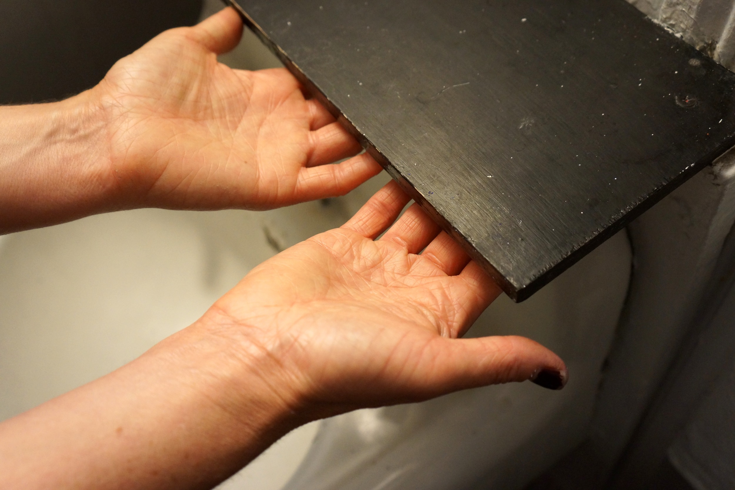 handsundershelf.jpg