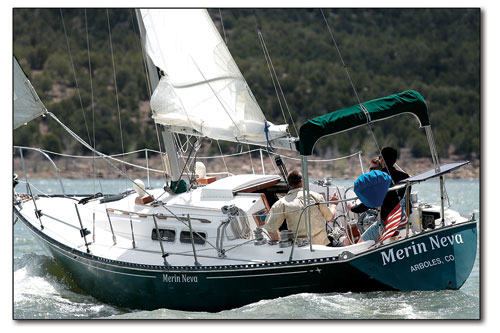 Aboard the S.S. Merin Neva, a 33-foot keel boat, with Scott Frazer and the Peaks & Tides staff. After a life on the water, kayaking, sailing and rafting, Frazer is making a go of his sailing school and charter service, based out of Navajo Reservoir./Photo by Jennaye Derge