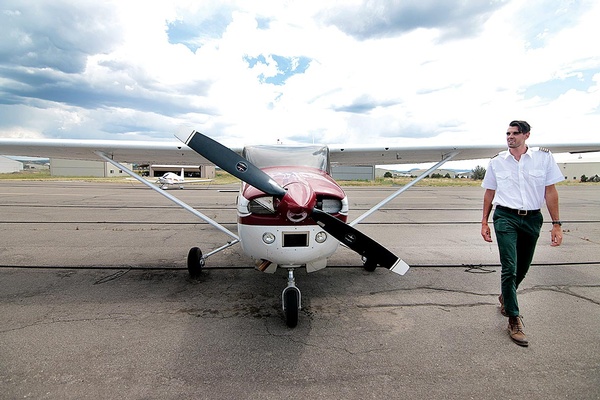 Owner of local scenic flight company Tall Pines Aviation, Max Wholey, prepares the Cessna 182 for an afternoon flight over the La Platas recently. Wholey, who is only 25 but spent his most of his life learning to fly, operates out of the Animas Airpark./Photo by Jennaye Derge