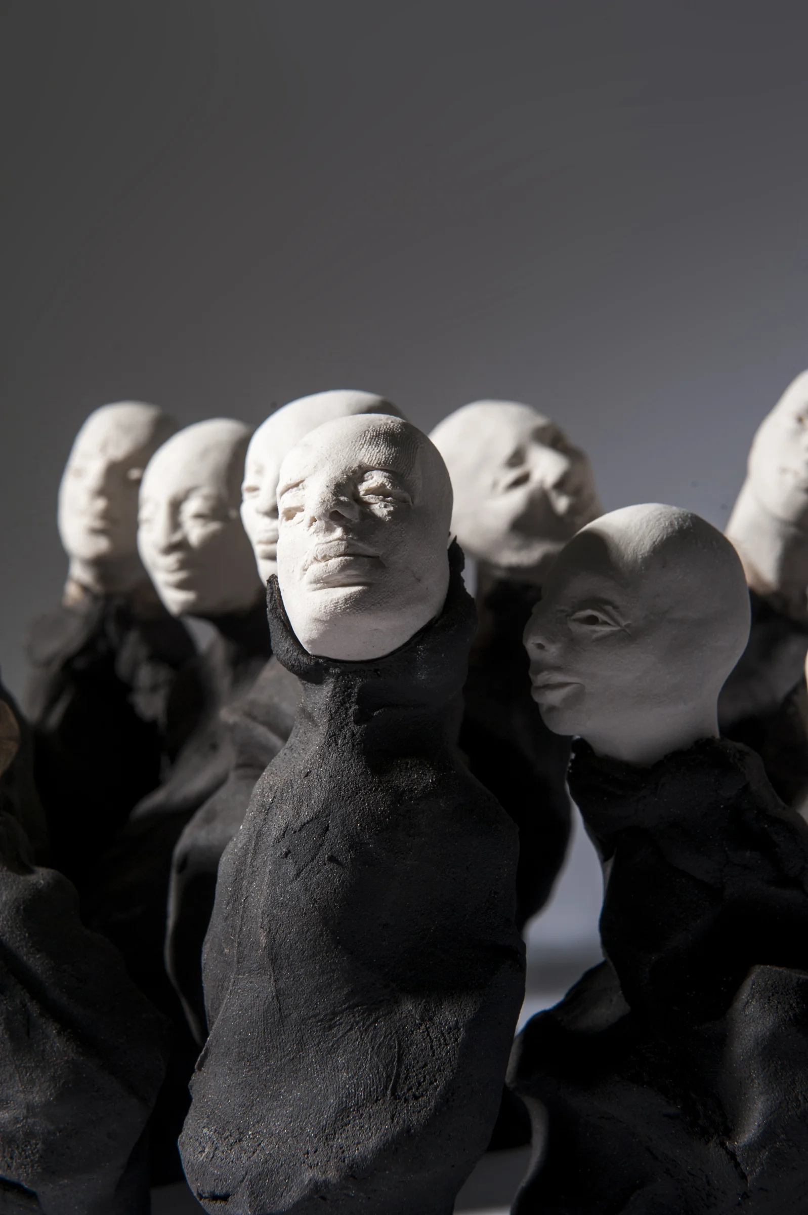 Crowd I \ porcelain and black clay \ dimensions variable \ Norwood Photography.