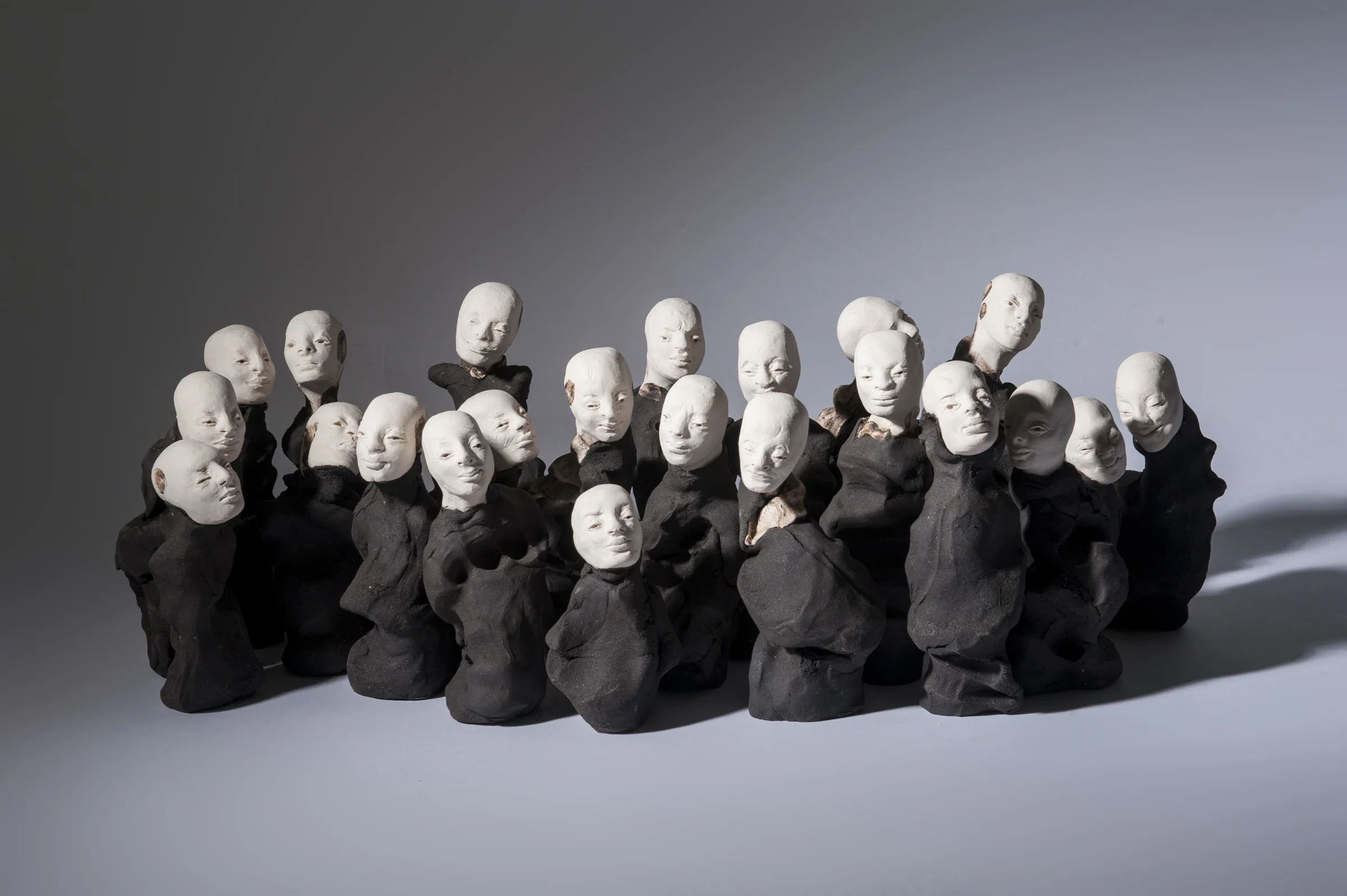 Crowd I \ porcelain and black clay \ dimensions variable \ Norwood Photography.