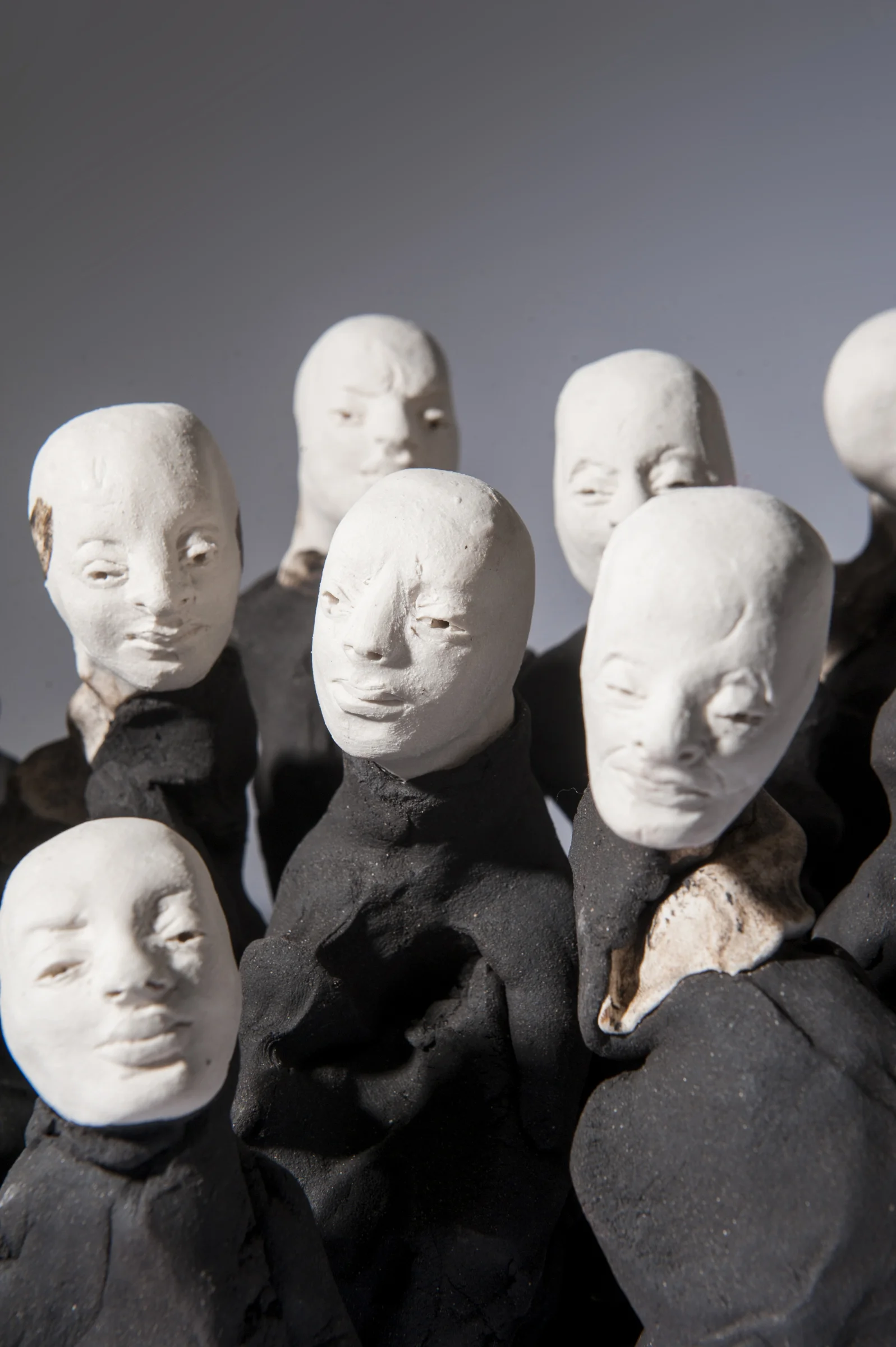 Crowd I \ porcelain and black clay \ dimensions variable \ Norwood Photography.