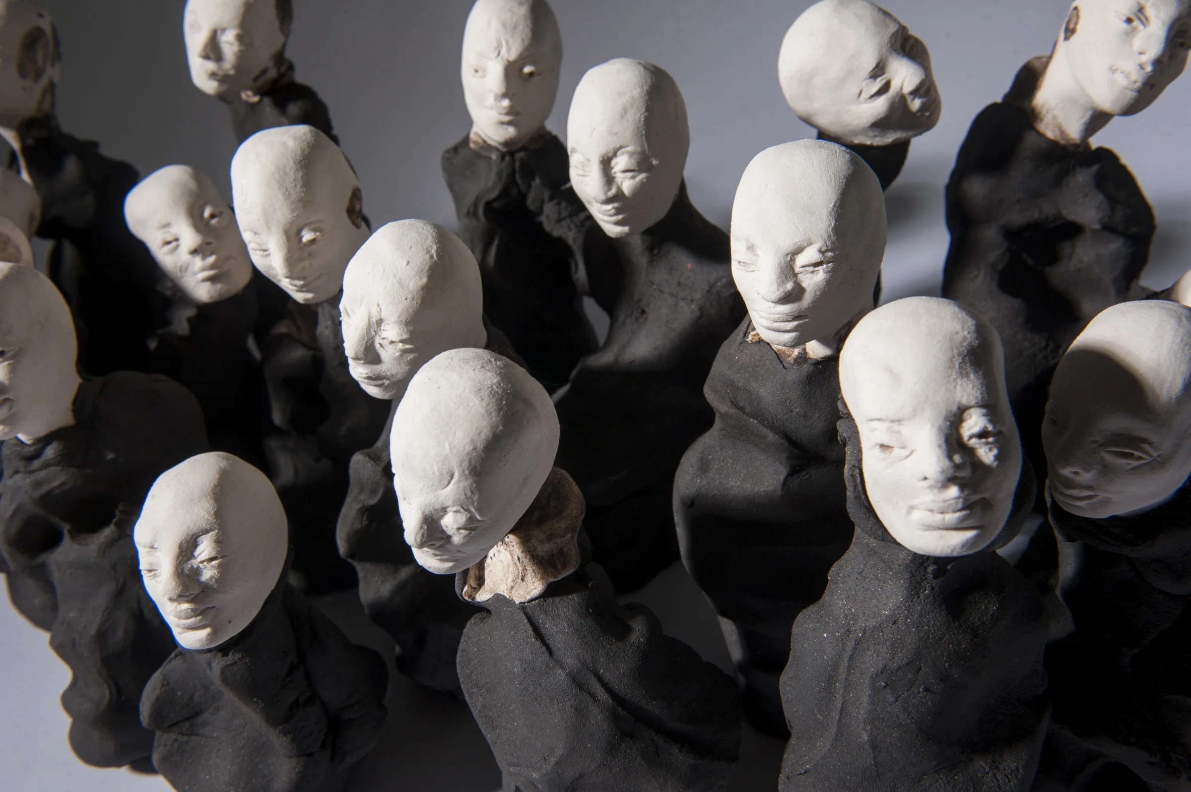 Crowd I \ porcelain and black clay \ dimensions variable \ Norwood Photography.