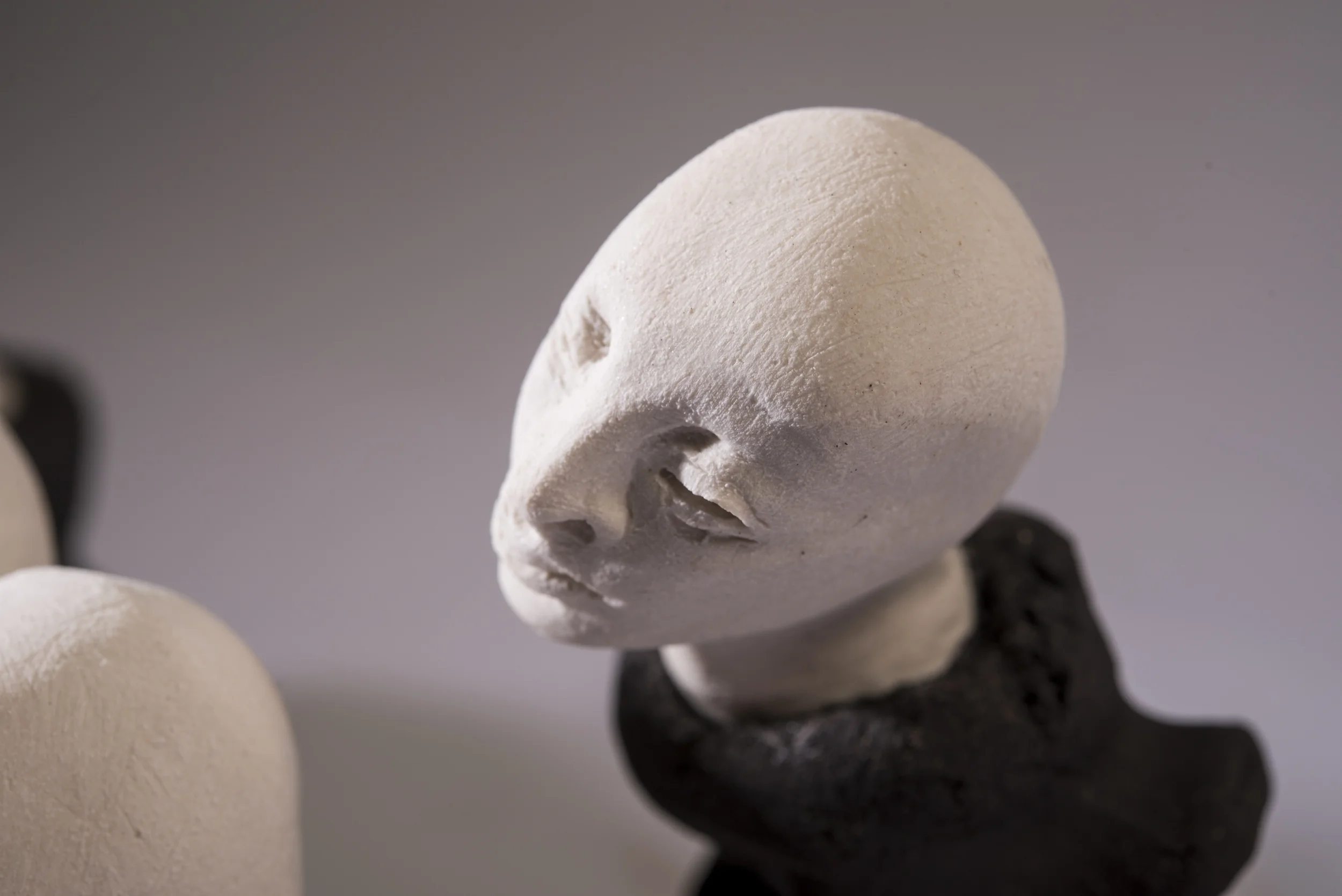 The Listener \ porcelain and black clay \ 17cm x 7 cm \ Norwood Photography.
