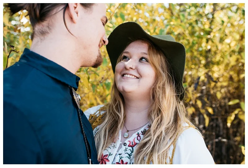 Stephanie looks lovingly at Daniel in Rocky Mountain National Park in Colorado. Engagement photography by Sonja Salzburg of Sonja K Photography.&nbsp;