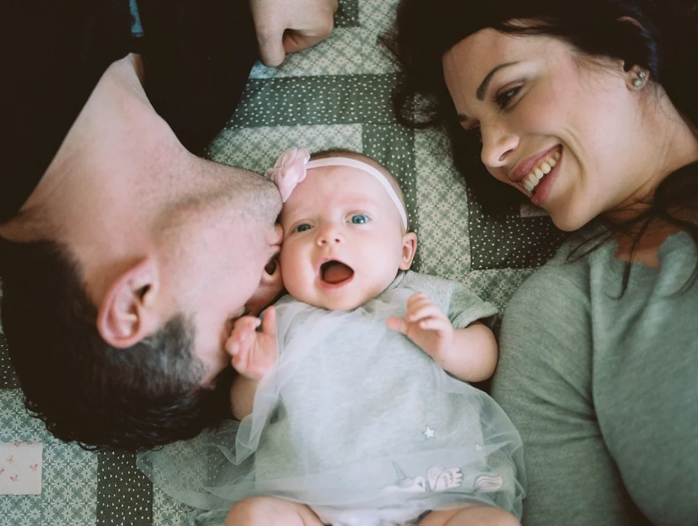 A young family at their home in Windsor, Colorado. Family portrait photography by Sonja Salzburg of Sonja K Photography.&nbsp;