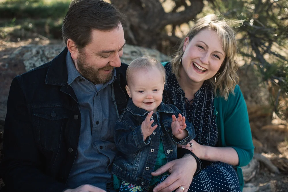 A happy family at Horsetooth Reservoir in Fort Collins, Colorado. Family portrait photography by Sonja Salzburg of Sonja K Photography.&nbsp;