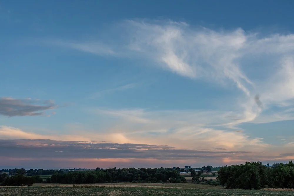 The sunset at the 2018 Fortified Collaborations Heart of Summer Farm Dinner at Colorado Stock and Grain Farm. Event and Food and Beverage photography by Sonja Salzburg of Sonja K Photography.