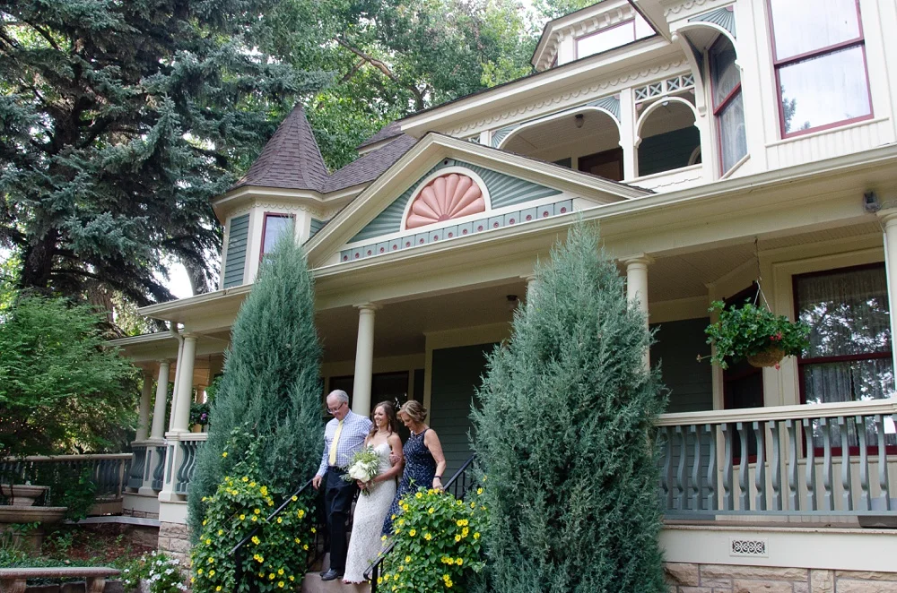 The enters the ceremony at the Tapestry House in Laporte, Colorado. Wedding photography by Sonja Salzburg of Sonja K Photography.