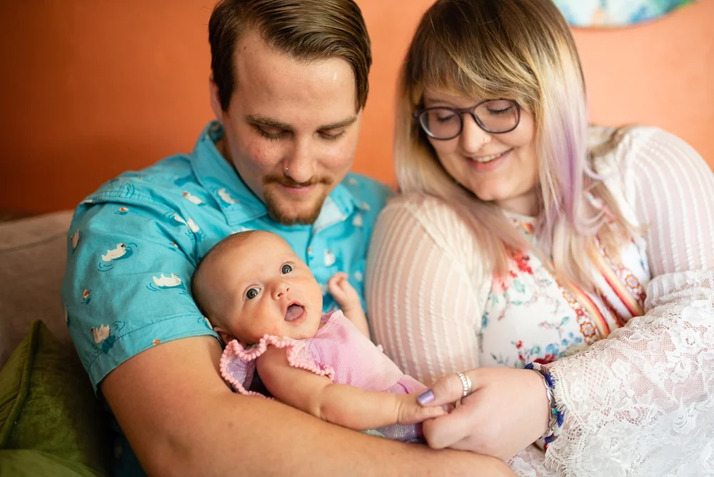 A happy family at home in Fort Collins, Colorado. Family portrait photography by Sonja Salzburg of Sonja K Photography.