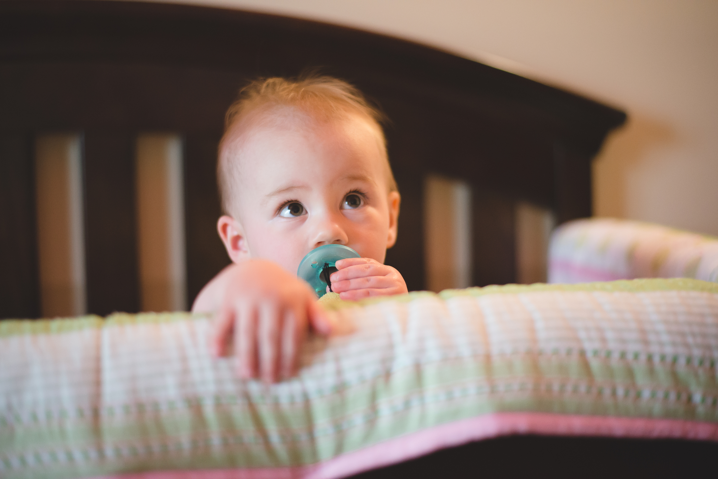 If you look closely, you can see her paci is attached to a little stuffed animal, affectionately known as "Ducky". He is well loved :)