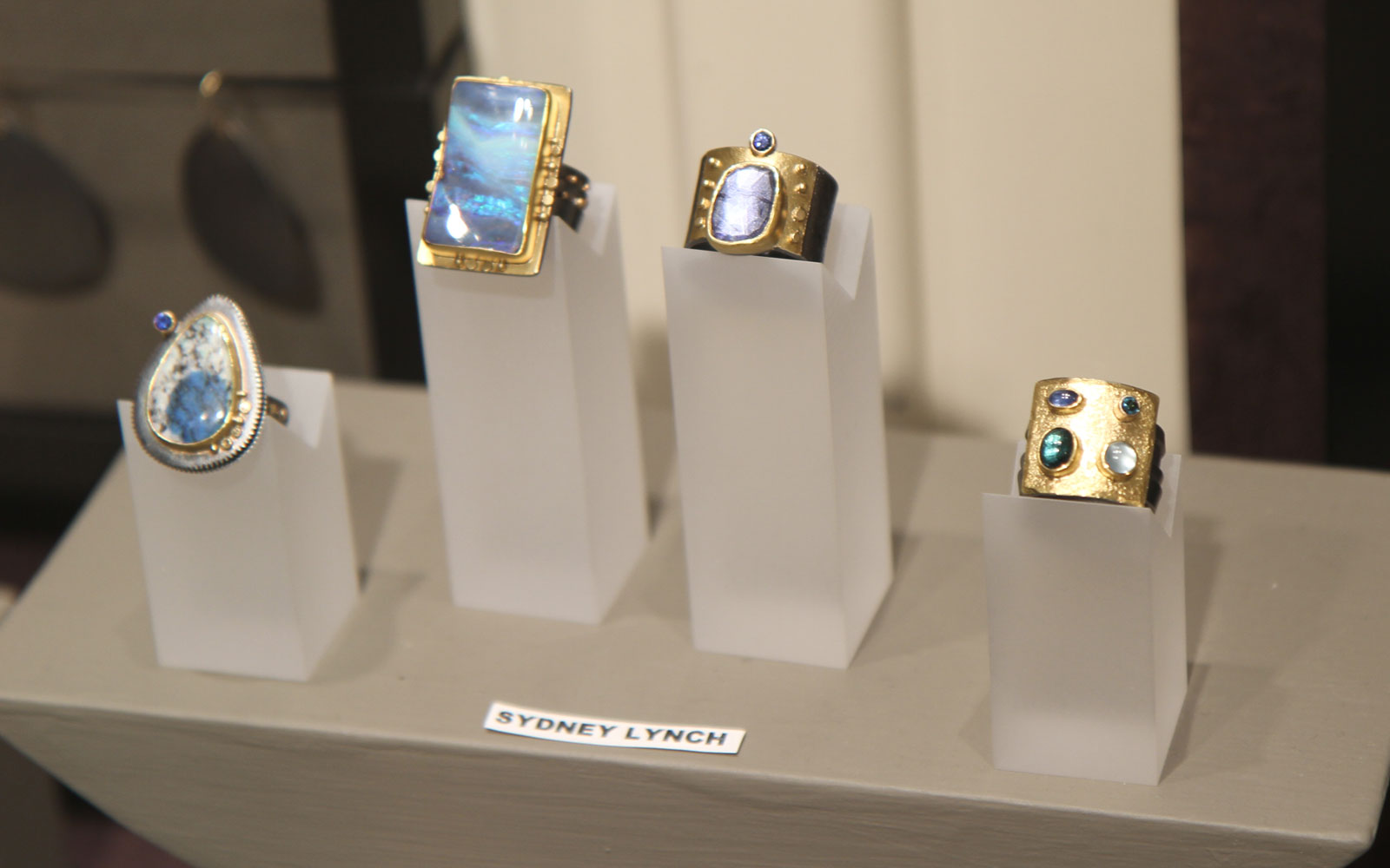 Sydney Lynch's artistically arranged rings, using silver, gold, opals and other assorted semi-precious gems.