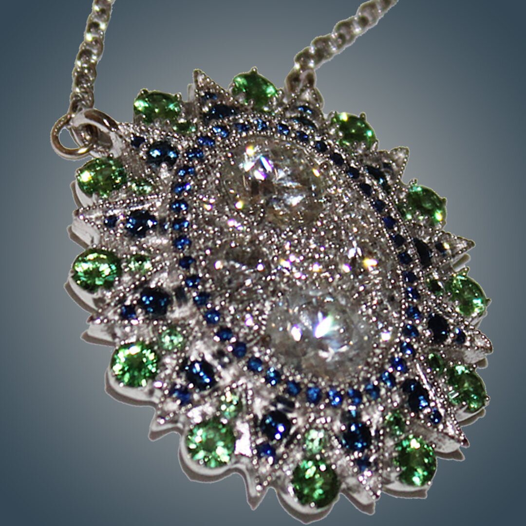 Repurposed diamonds and platinum, mixed with new sapphires and Tsavorite garnet.  A timeless custom made piece of jewelry.