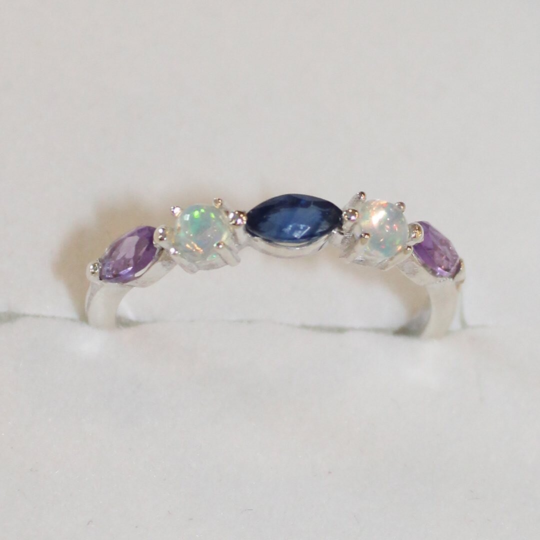 A ring is forever.  This special band was created for a soon to be sister in law, using marquise gemstones from client&rsquo;s own jewelry and adding her birthstone of Opal.  In this project, I sourced Ethiopian opal and they are so flashy and vibran