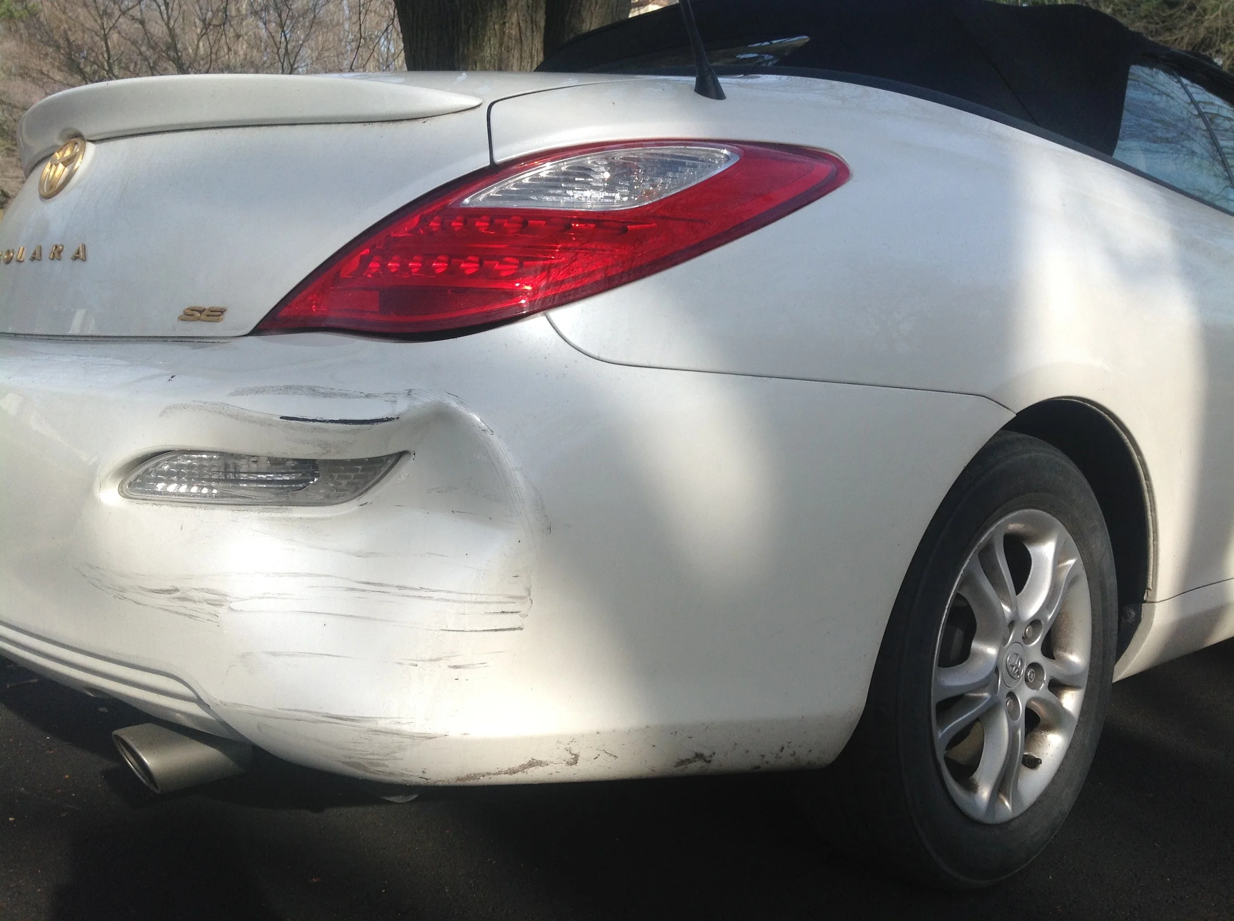 Oops... this rear corner got smooshed in and scraped up.