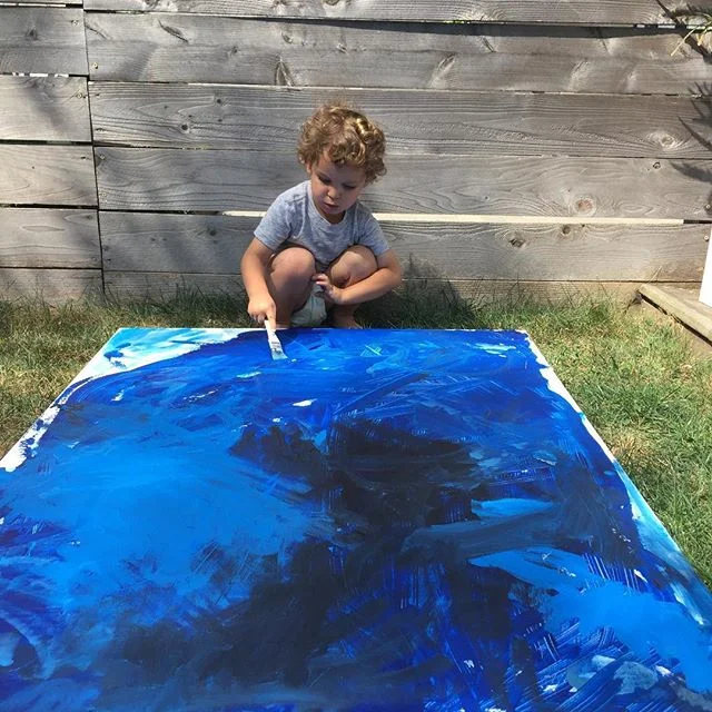 Working on some art for his baby brother