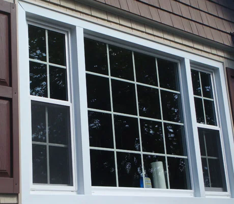 Aluminium window trim with vinyl j-channel