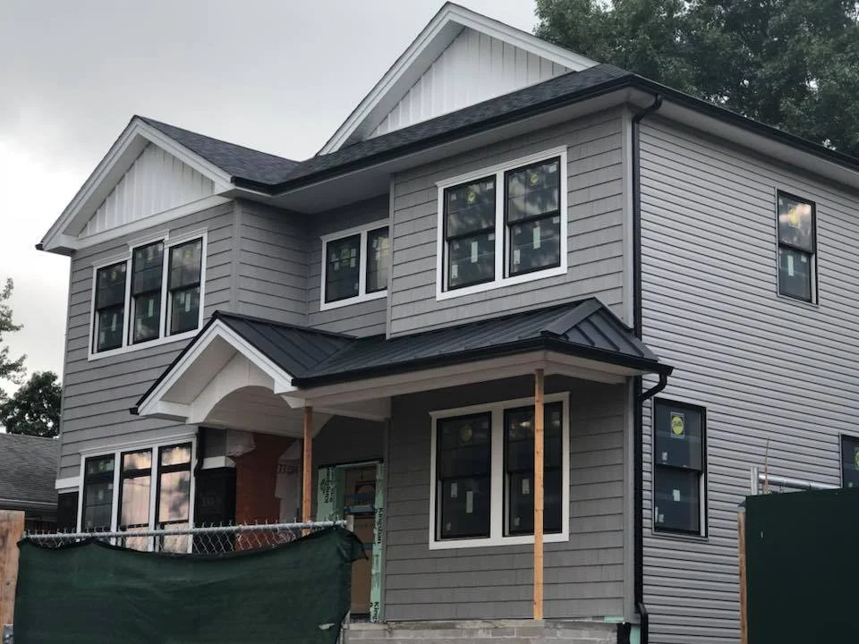 Vinyl Shake with siding and metal roof. Complemented by Board and Batten in the gables and Azek finishes.jpg