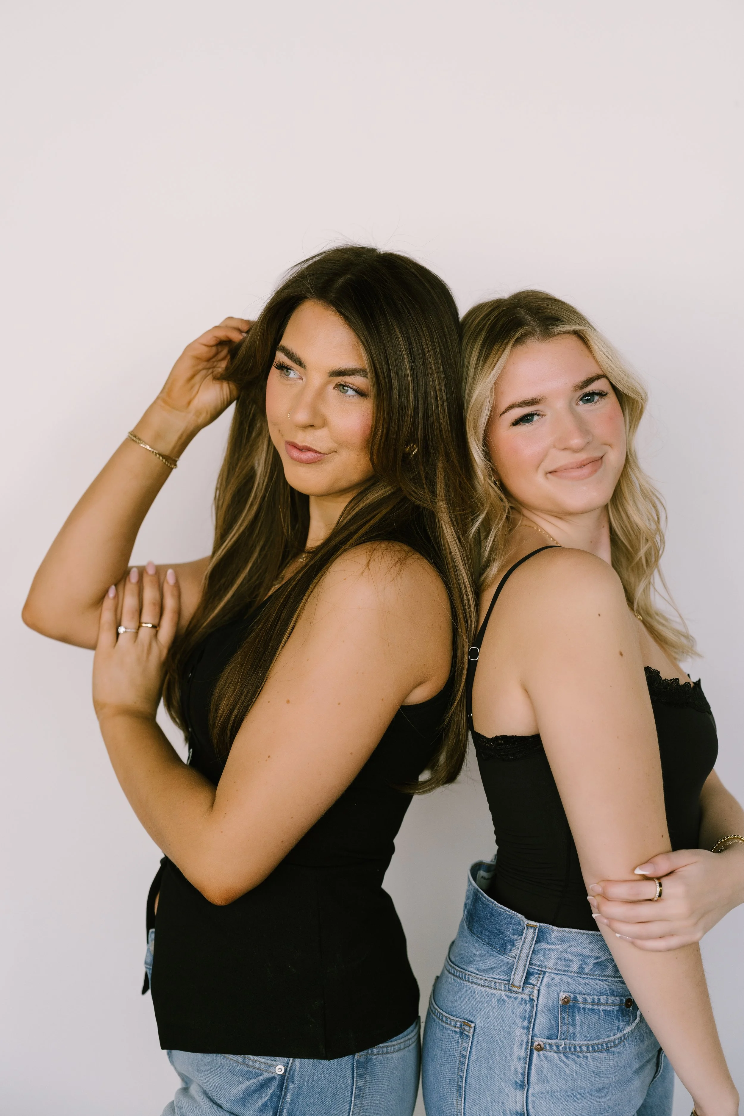 branding photos for two hairstylists with white backdrop in rochester, NY studio