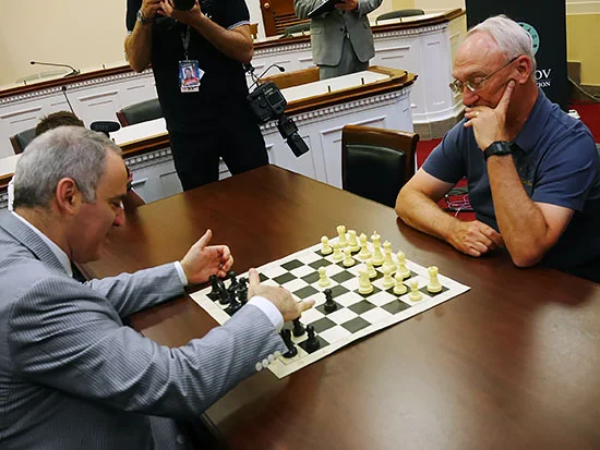 Rex Sinquefield (R) and Gary Kasparov (L) square off