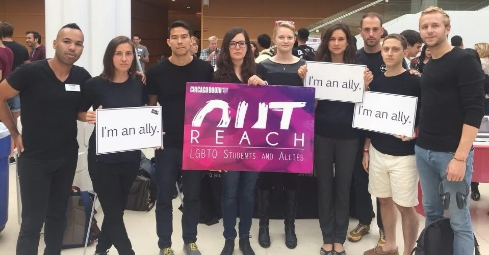 Rachel Chamberlain '17 (center) and members of OUTreach, Booth's LGBT+ student group, "wear black" to show allyship for African-Americans and other minorities in the Booth community and around the country.