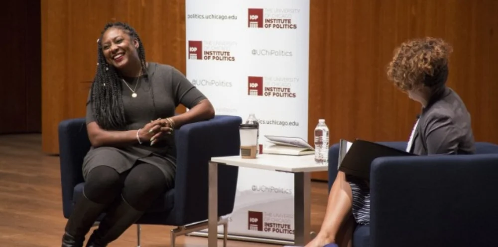 Alicia Garza (left), co-founder of the Black Lives Matter organization, and Eve Ewing (AB ‘08), a p ostdoctoral scholar at the University of Chicago School of Social Service Administration, engage in a deep discussion hosted by the Institute of Politics. Photo courtesy of the Institute of Politics