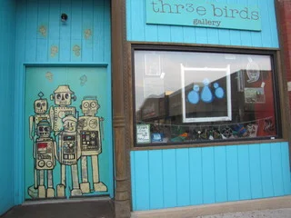 Adorable robots greet art-seeking patrons at Thr3e Birds Gallery. Photo courtesy of ArtSlant