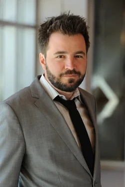 Professor Emir Kamenica
