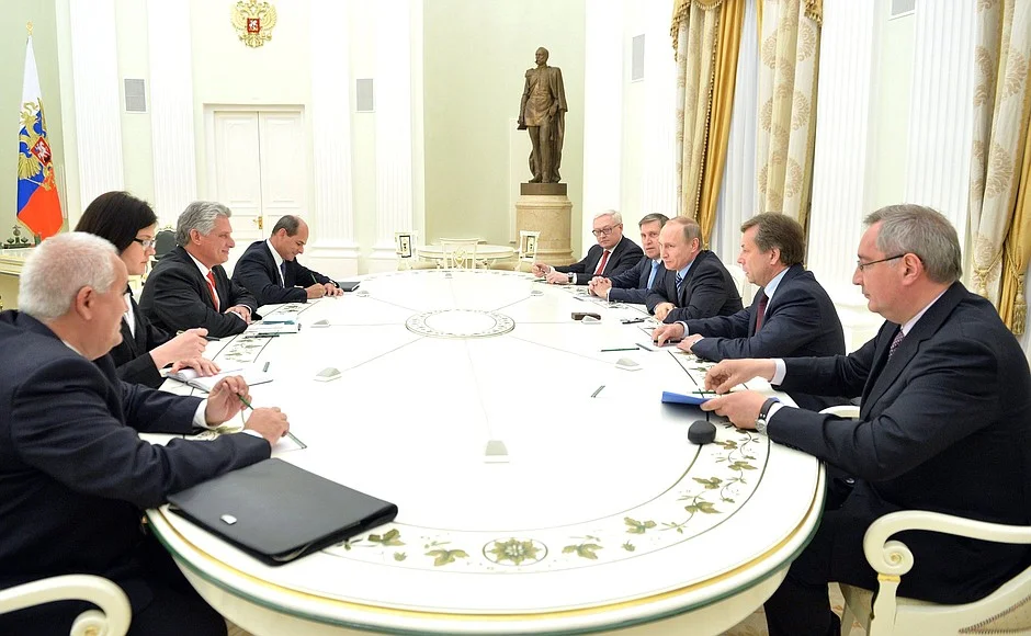 As First Vice President, Miguel Diaz-Canel (left) sits with Russian President Vladamir Putin discussing bilateral trade and economic cooperation.