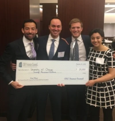 Boothies receiving their $20,000 first prize check at the inaugural CREFC case competition.