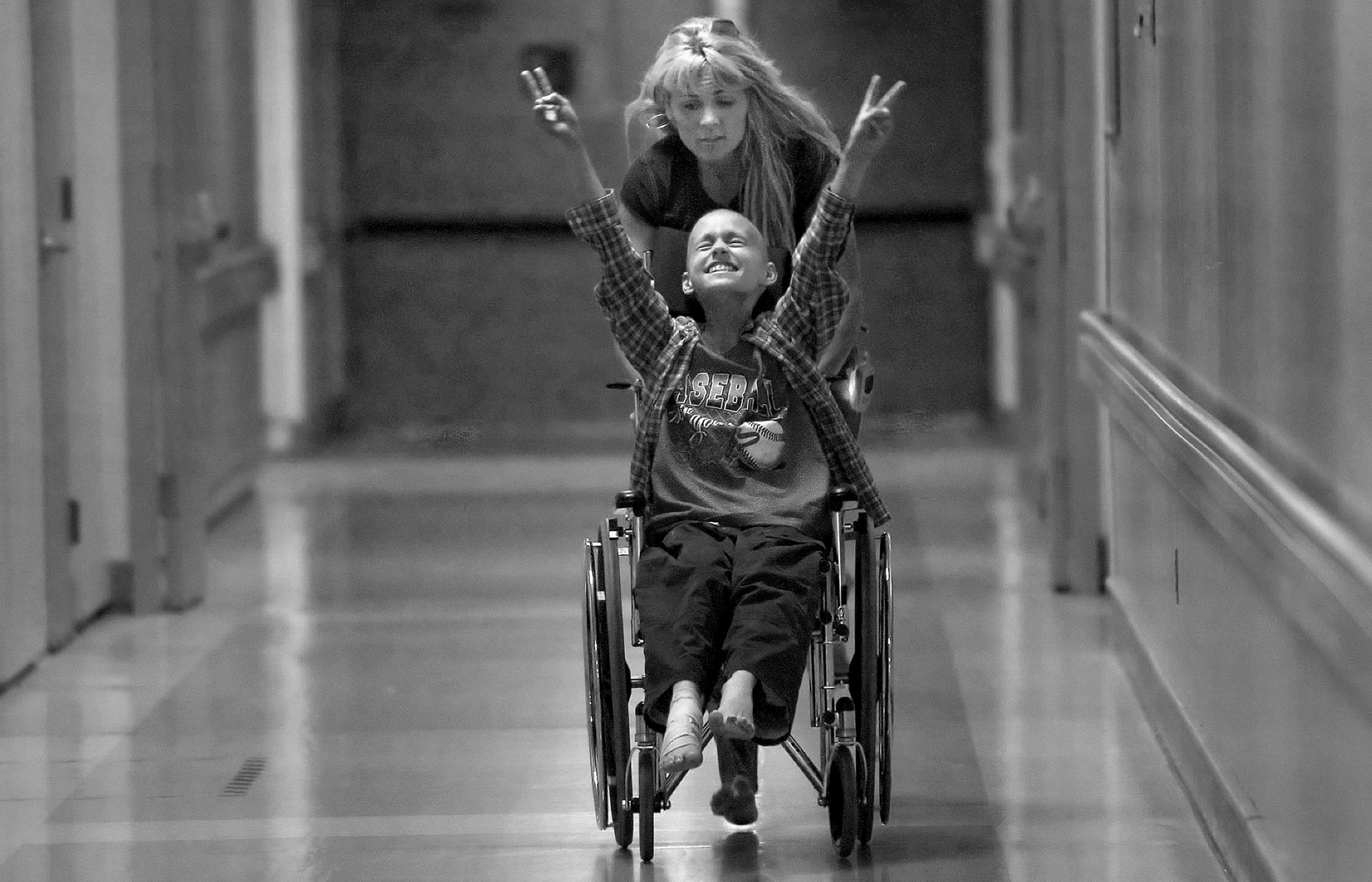 2007 Pulitzer Prize for Feature Photography , " A Mother's Journey, " Racing barefooted after kicking off her flip-flops, Cyndie French pushes her son Derek Madsen up and down hallways in the UC Davis Medical Center. © Renée C. Byer/Sacramento Bee/ZUMAPRESS.com