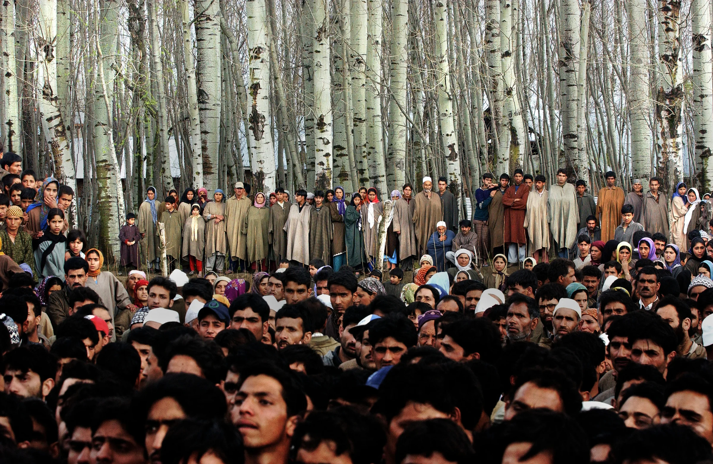 Villagers mourn the death of five people who were killed along with 48 who were injured, when a grenade exploded in the hands of a man who was seeking to extort money from a family in the Badgam district of Kashmir. 2004 © Ami Vitale