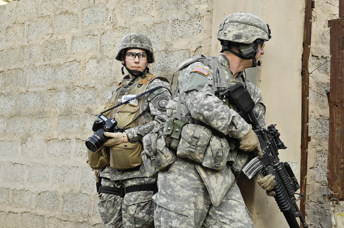 Staff Sergeant Stacy Pearsall documents combat operations with the 1st Cavalry Division, 12th Infantry Regiment, in Khalis, Iraq. 2007. Photo by Andy Dunaway