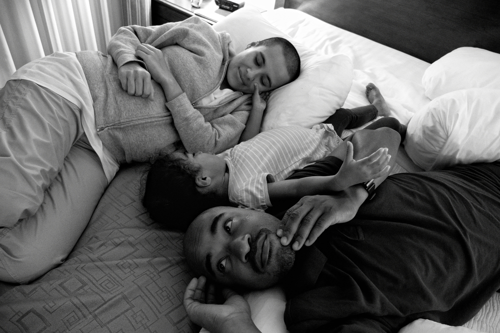  The Richardsons relax in their hotel room after a taxing visit to Carlos' father in Augusta, GA. 2012&nbsp;© Zun Lee 