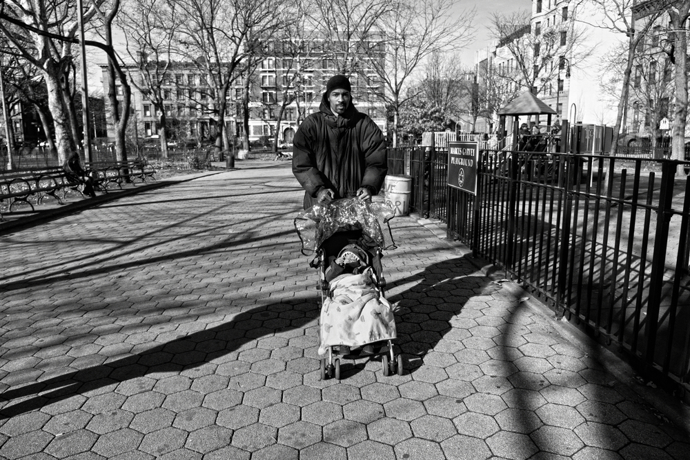  Guy Miller with son Guy Jr. on a chilly day at Marcus Garvey Park. 2012&nbsp;© Zun Lee 