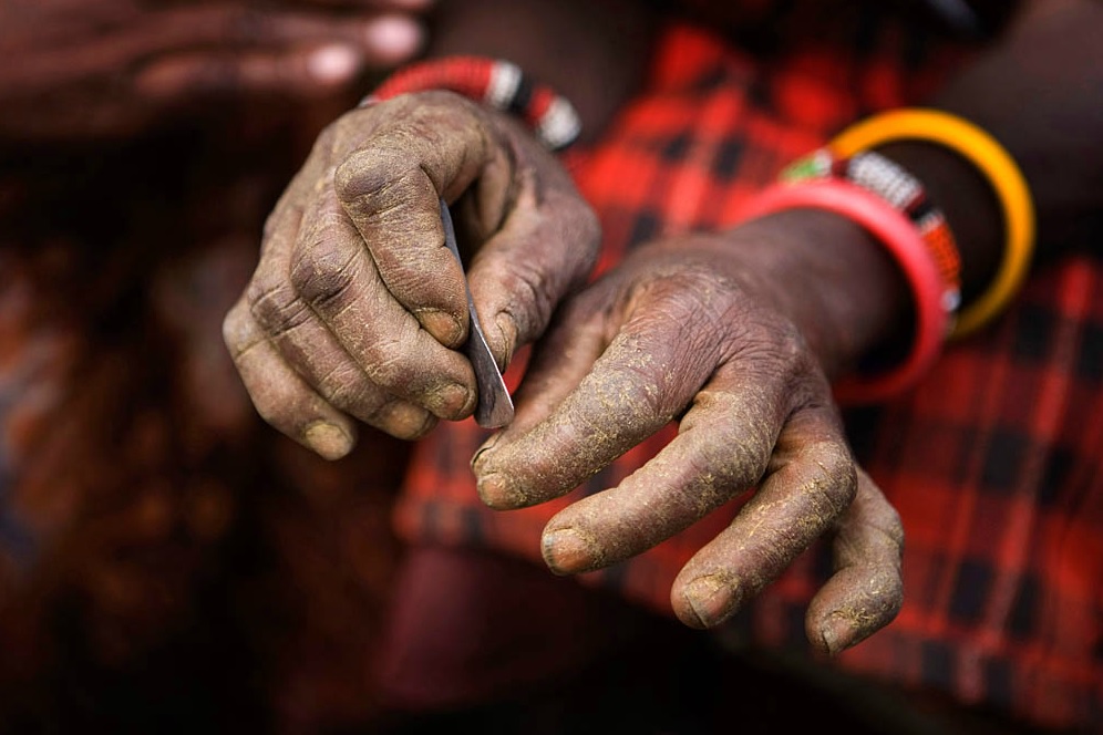   Traditional Blade:  Kameli, Kenya. A Maasai villager displays the traditional blade used to circumcise young girls before the practice became illegal in Kenya. © Marvi Lacar 