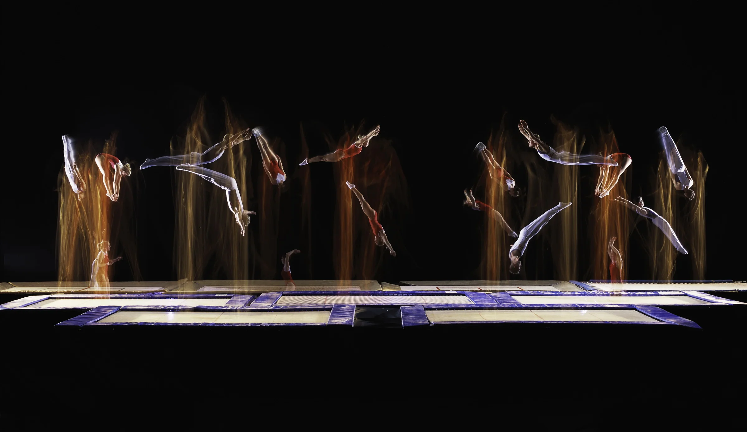 New to the 2000 Olympics, competitors perform compulsory routines on the trampoline. Lubbock, Texas Sports Illustrated 2000 © Joe McNally