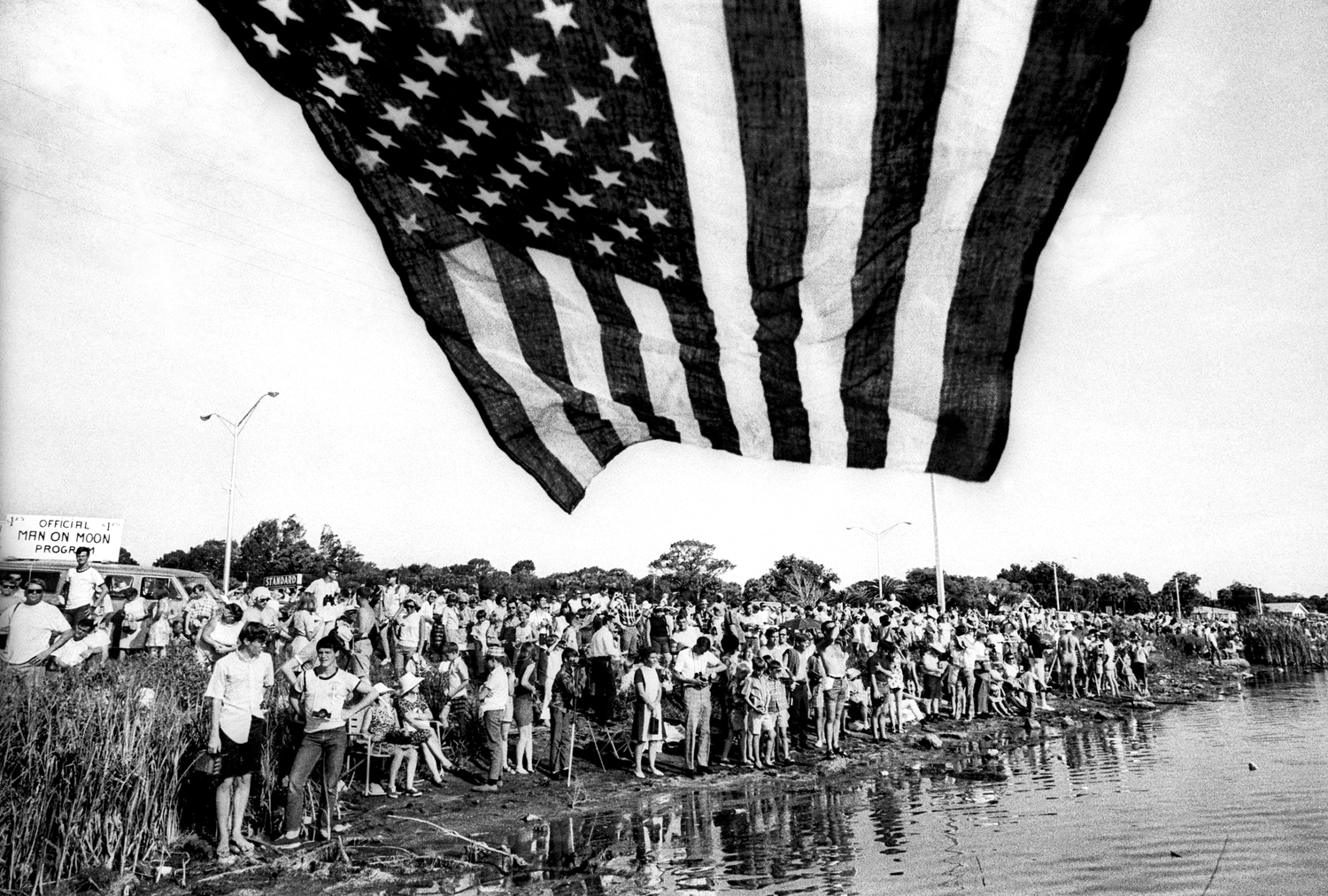 A crowd gathers to watch the Launch of Apollo XI at Kennedy Space Center. Apollo XI was the spaceflight that landed the first humans on the moon. July 16, 1969 © Jean-Pierre Laffont