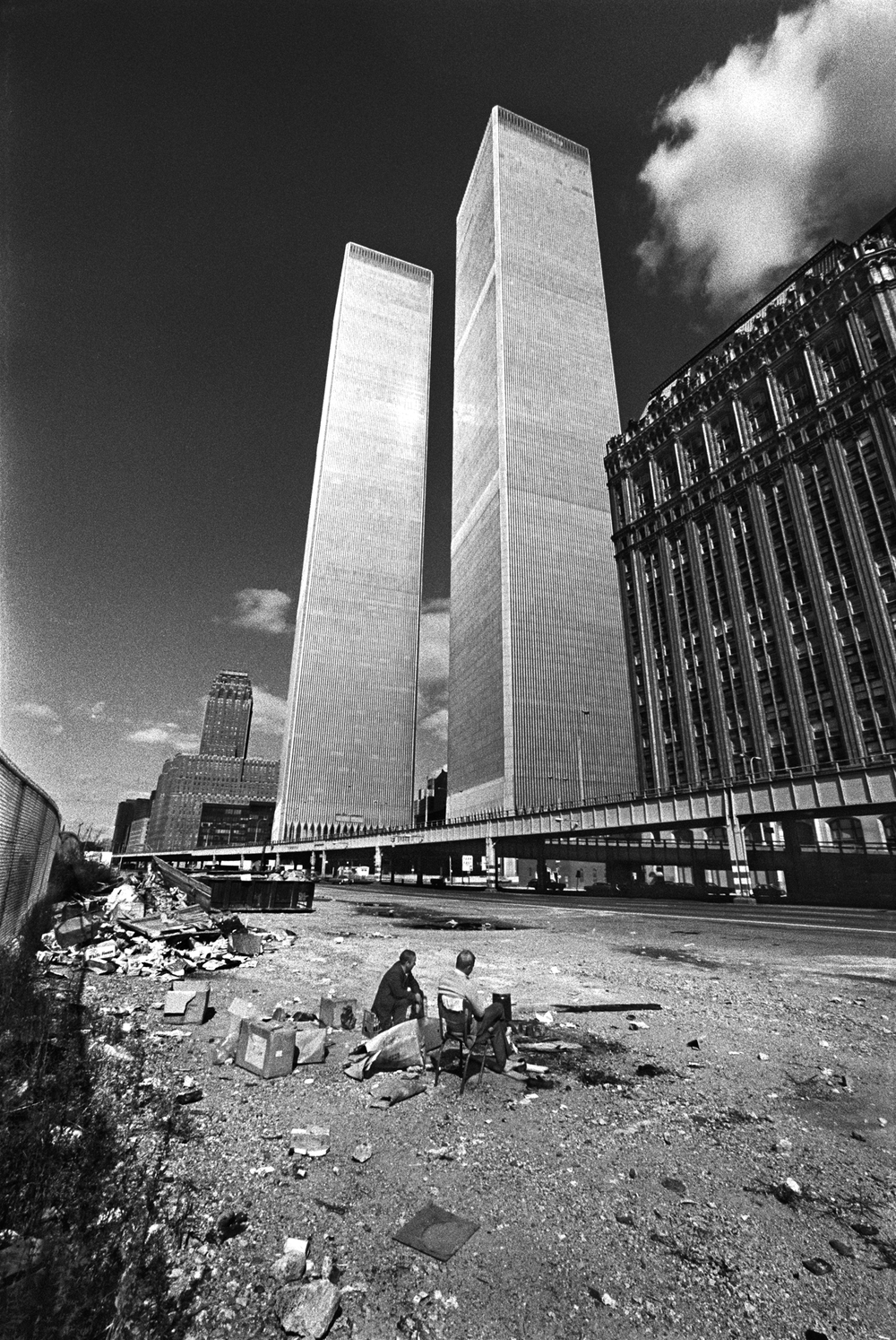  Two homeless men squat below the recently constructed World Trade Center. New York City was bankrupt, in shambles and the building was not occupied.  October, 1975 &nbsp;© Jean-Pierre Laffont 