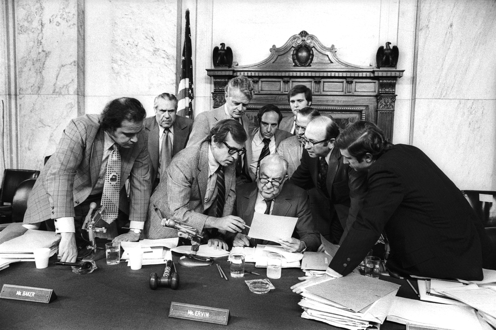  The Watergate Hearings:&nbsp;(l to r) Fred Thompson, Howard Baker, Edward Gurney, Sam Erwin (seated center) Samuel Dash, and unidentified) in discussion.&nbsp; August 9, 1974 &nbsp;© Jean-Pierre Laffont 