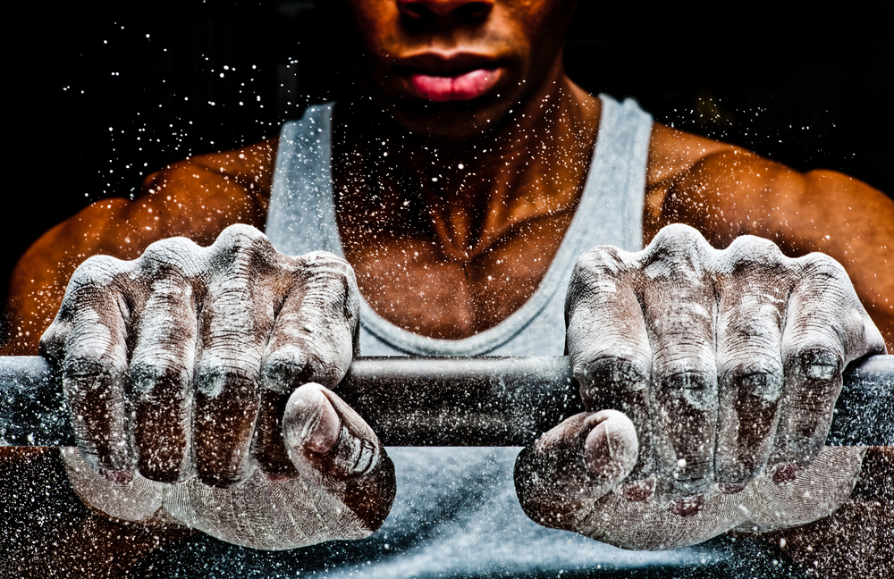  Chalk covers the hands of a body builder&nbsp;© Rob Hammer 