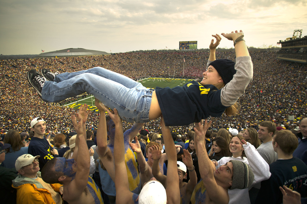   Michigan freshman Diana Schorry, 18, gets tossed after Michigan scored against Ohio State with 7:55 left in the fourth to go up 35-21 at Michigan Stadium in Ann Arbor. November 22, 2003&nbsp;© David Bergman  