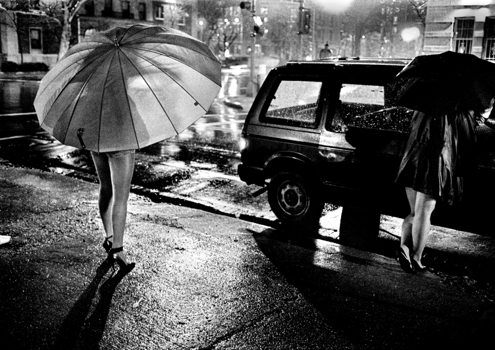  We were doing a story on a new program that tried to get prostitutes off the streets and I had spent days and days trying to photograph these women, finally on a rainy&nbsp;day they agreed because of the umbrellas.&nbsp;© Nancy Andrews/The Washingto