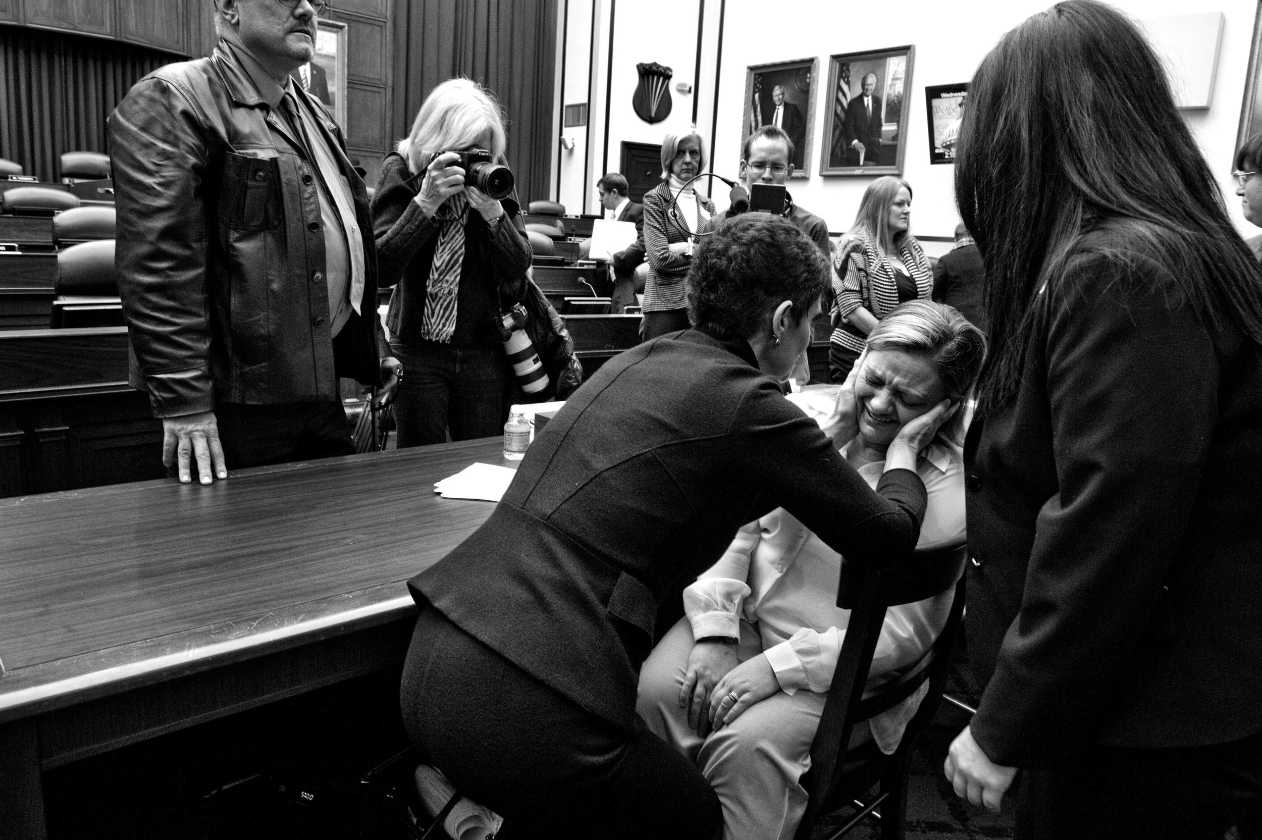 The War Within: TSgt. Jennifer Norris, who was drugged and raped by her recruiter after joining the US Air Force when she was 21-years-old, is comforted by Nancy Parrish, President of Protect Our Defenders, as she breaks down after testifying
