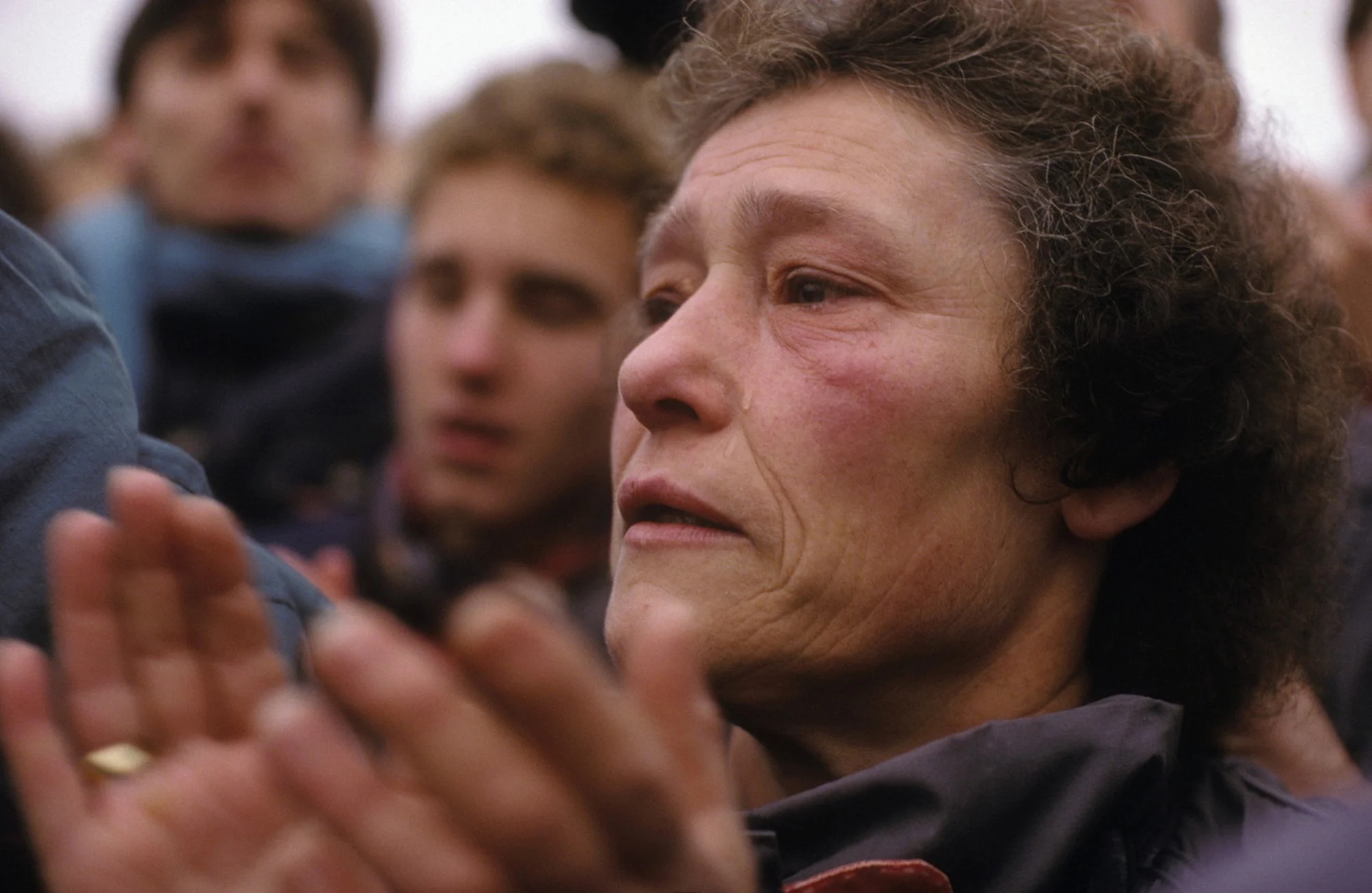 The fall of the Berlin Wall, 1989: A West Berlin woman tearfully welcomes her Eastern family. © 2015 David Burnett/Contact Press Images