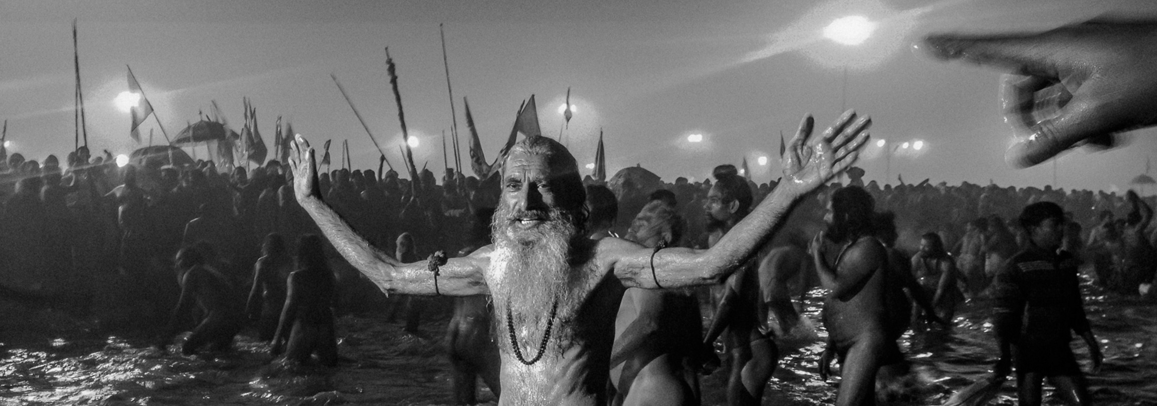 Naga sadhus bathe on the banks of Sangam, the confluence of the holy Ganges and Yamuna rivers during the auspicious bathing day of Makar Sankranti, the start of the Maha Kumbh Mela in Allahbad, India. January 14, 2013 © Daniel Berehulak/Getty Images